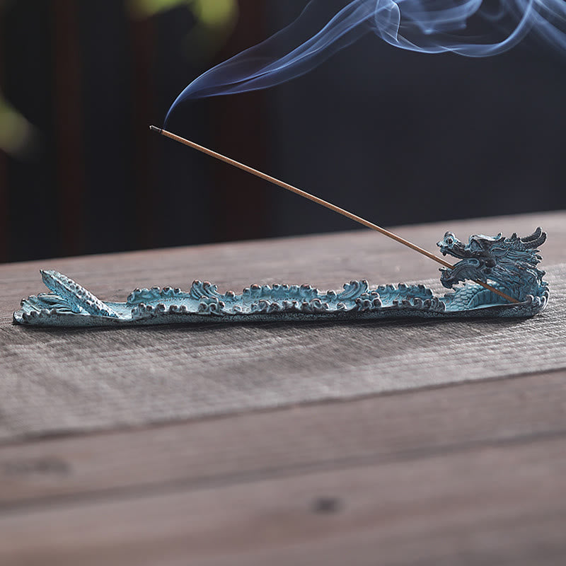 Dragon Alloy Incense Burner - Smoke curling from dragon mouth on natural wood, meditative