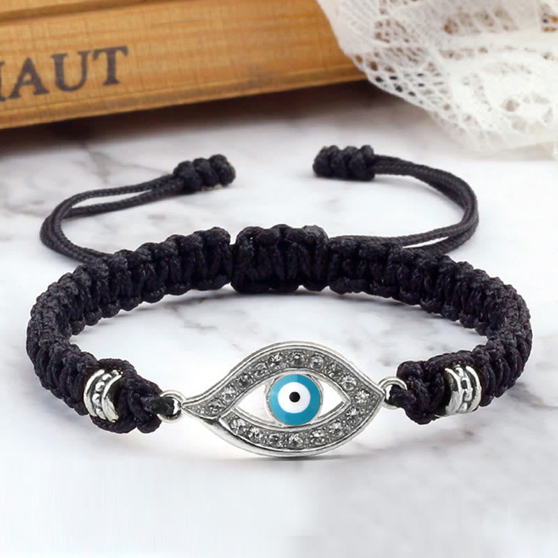 Black cord evil eye bracelet with silver blue evil eye crystal charm, marble styling