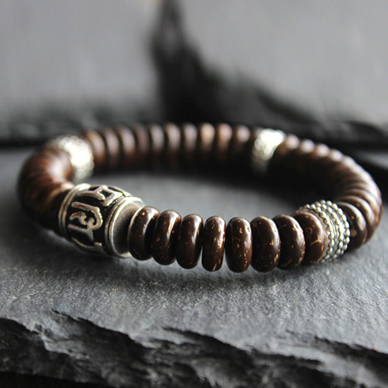 Om Mani Padme Hum Coconut Shell Bracelet – diagonal shot with silver spacer, coconut bead bracelet