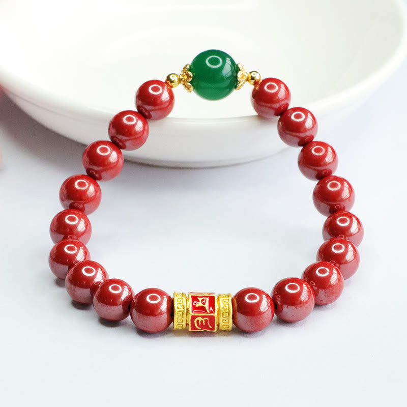 Cinnabar Agate Bracelet – Upright on white background, green agate bead with gold caps