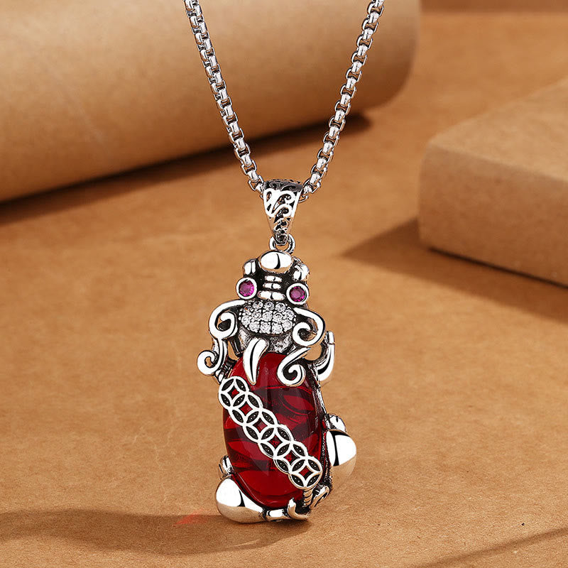 Garnet PiXiu Necklace – Silver PiXiu pendant with deep red garnet body on silver chain, passion jewelry