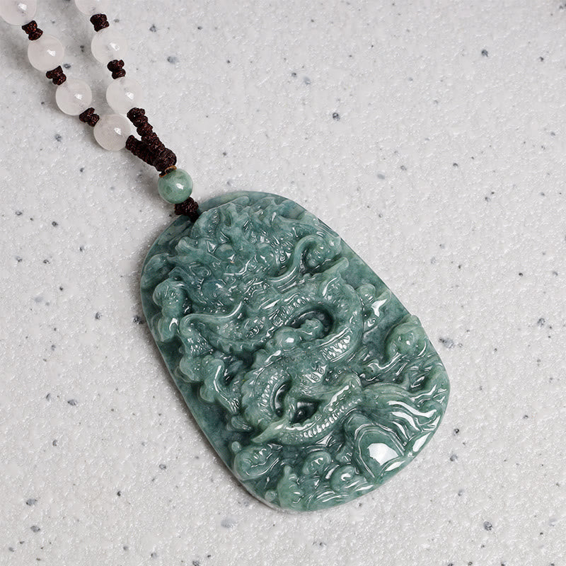 Chinese Zodiac Dragon Jade Necklace - Mottled jade dragon pendant with white bead cord on gray, Prosperity