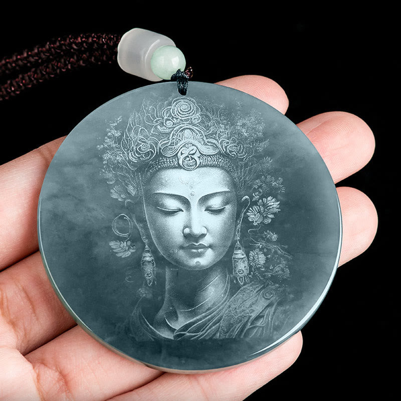 Kwan Yin Jade String Necklace – hand-held closeup of carved bodhisattva pendant showing jade translucency and natural inclusions, serene devotional piece
