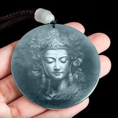 Kwan Yin Jade String Necklace – hand-held closeup of carved bodhisattva pendant showing jade translucency and natural inclusions, serene devotional piece