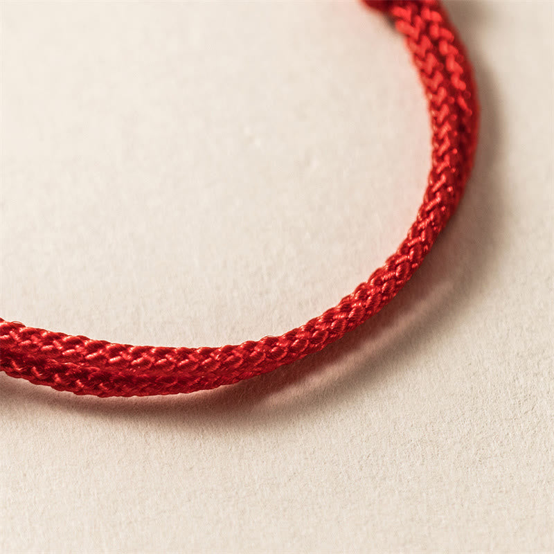 Sterling Silver Dragon Red Rope Bracelet - macro close-up of woven red cord bracelet texture, Craftsmanship