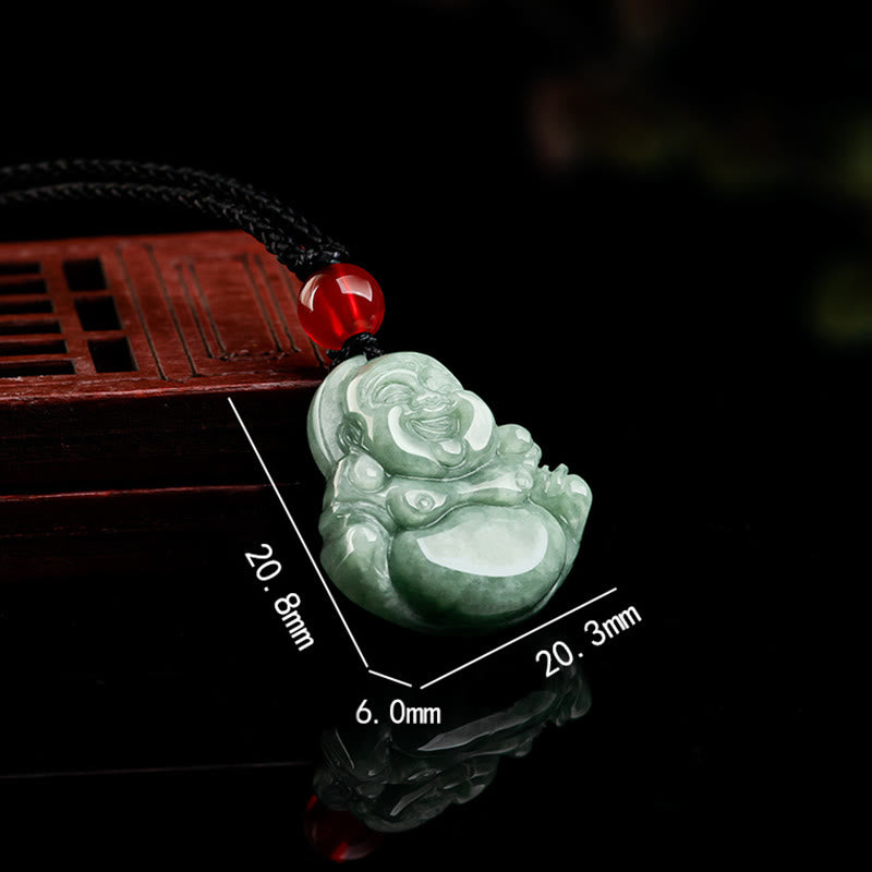 Green Jade Buddha Pendant Side - 3/4 angled view of carved jade on reflective black surface with wooden prop, Harmonious