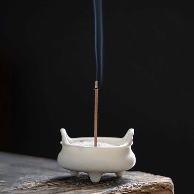 Dragon Ceramic Incense Burner – round censer on woven mat, minimalist handles, dark interior, serene