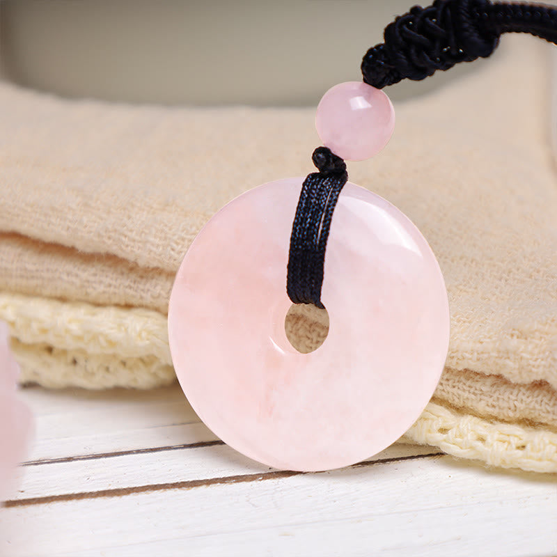 Lucky Coin Pendant Healing Crystal Gemstone Necklace – Translucent pink rose quartz peace buckle disc on adjustable black cord