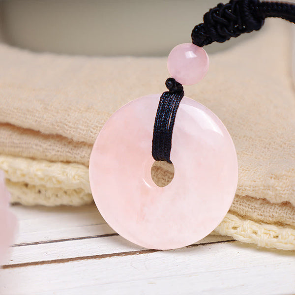 Lucky Coin Pendant Healing Crystal Gemstone Necklace – Translucent pink rose quartz peace buckle disc on adjustable black cord
