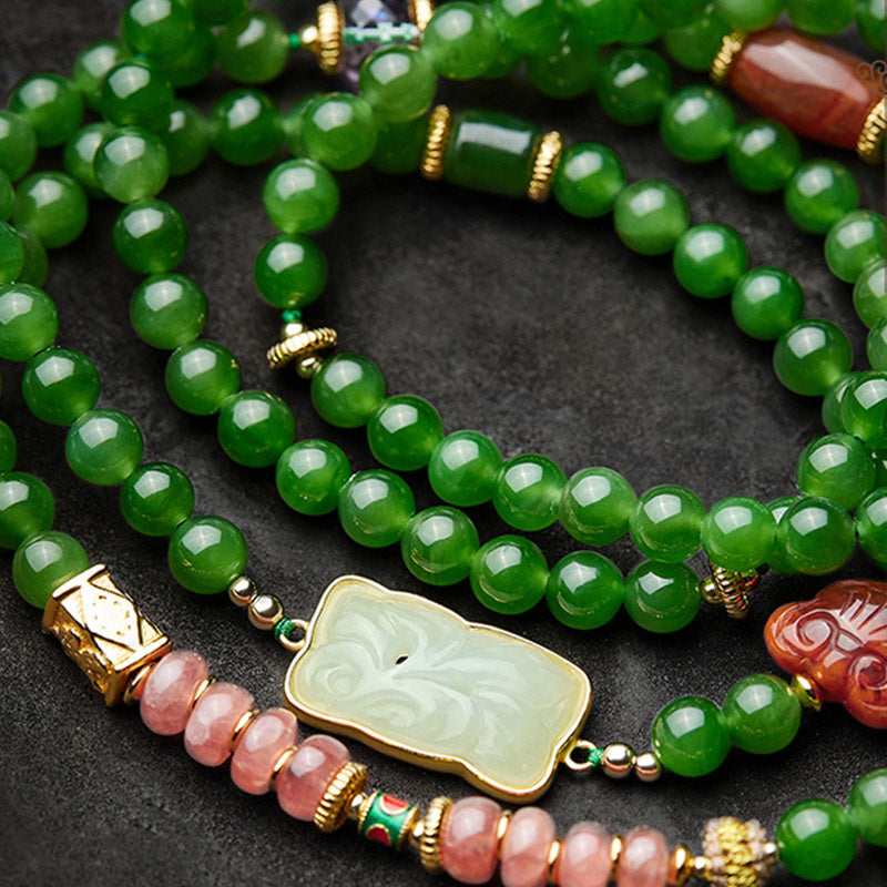 108 Mala Beads Jade Agate Bracelet – Displayed on silk fabric with soft light, luxury showcase