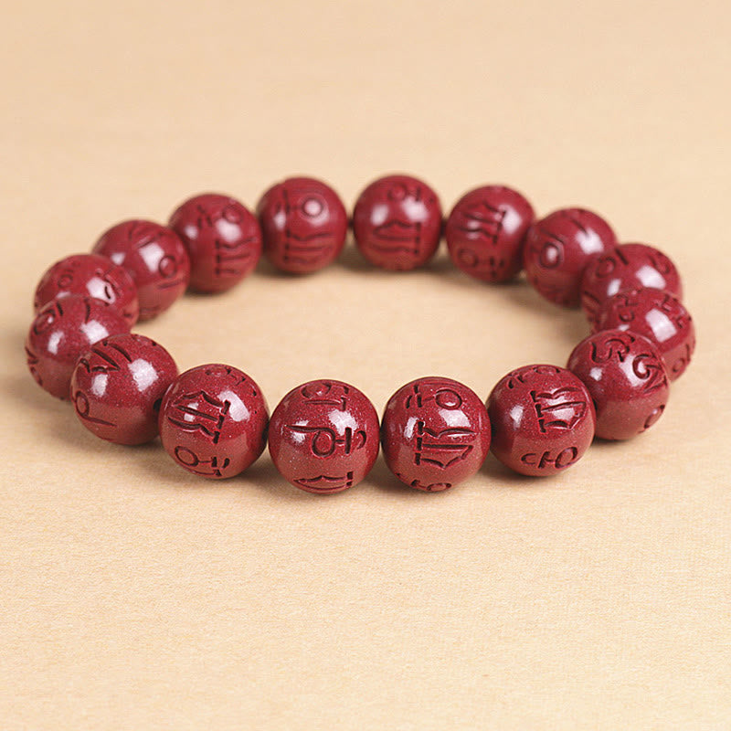 Double PiXiu Cinnabar Bracelet – Carved cinnabar mantra beads on beige textured background, zen bracelet