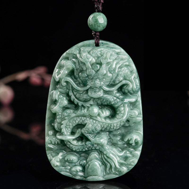 Chinese Zodiac Dragon Jade Necklace - Deep relief dragon jade pendant on burgundy cord, black background, Luck
