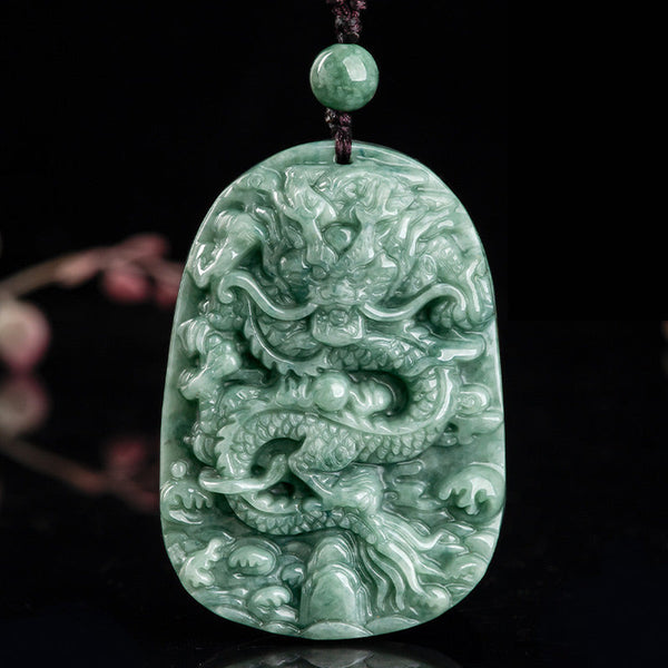Chinese Zodiac Dragon Jade Necklace - Deep relief dragon jade pendant on burgundy cord, black background, Luck