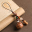 Peach wood Feng Shui phone charm with peanut accent, lotus bead and green agate stone