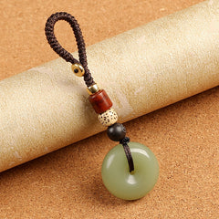 Natural celadon agate ping an kou peace buckle keychain on golden decorative scroll