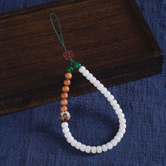 White Jade Bodhi & Jadeite Crystal Phone Charm – White round bodhi beads with green jadeite and small wooden flower charm