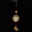 Feng Shui Sandalwood Keychain with Luminous Bead – Green sandalwood circular frame with glowing jade center and double gourd pendant on black background