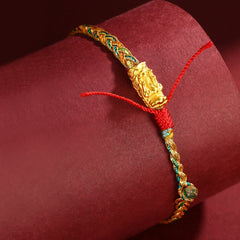 Colorful Dragon Carved Braided Bracelet – Intricate gold dragon charm close-up on braided display, Cultural