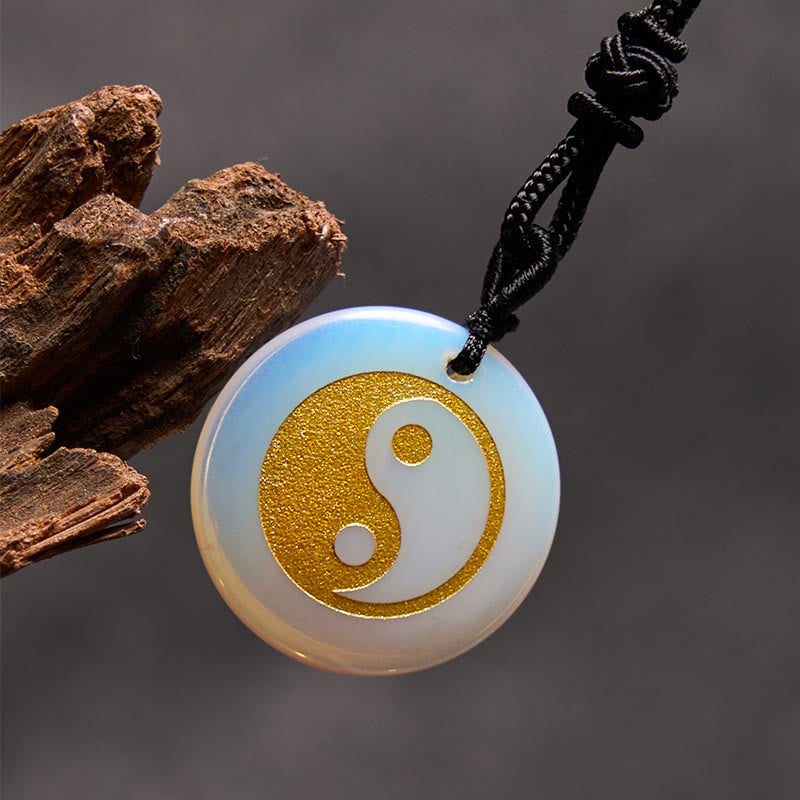 Yin Yang Crystal Necklace – Opalite round pendant with gold glitter yin-yang symbol, iridescent milky white stone with blue s