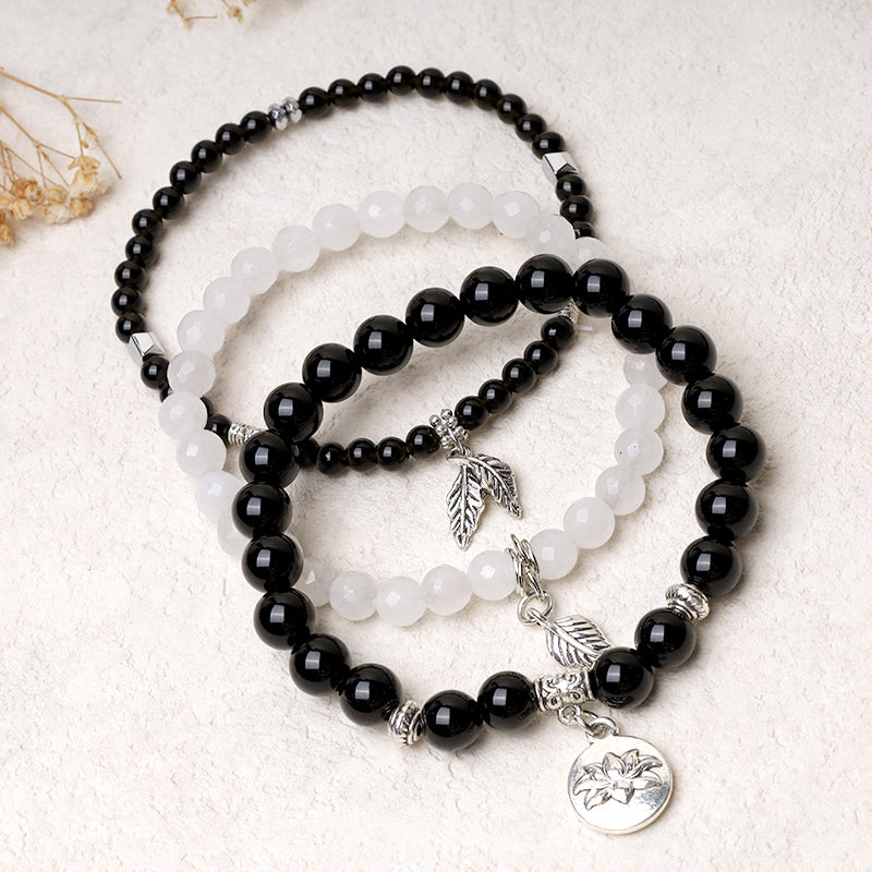 Natural Crystal Bracelet – black and white beaded stack with silver lotus flower medallion, yin-yang bracelet
