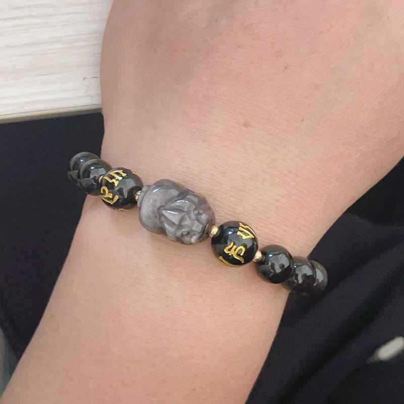 Silver Sheen & Black Obsidian PiXiu Bracelet – worn on wrist showing gold-inscribed beads and detailed Pixiu carving, men’...