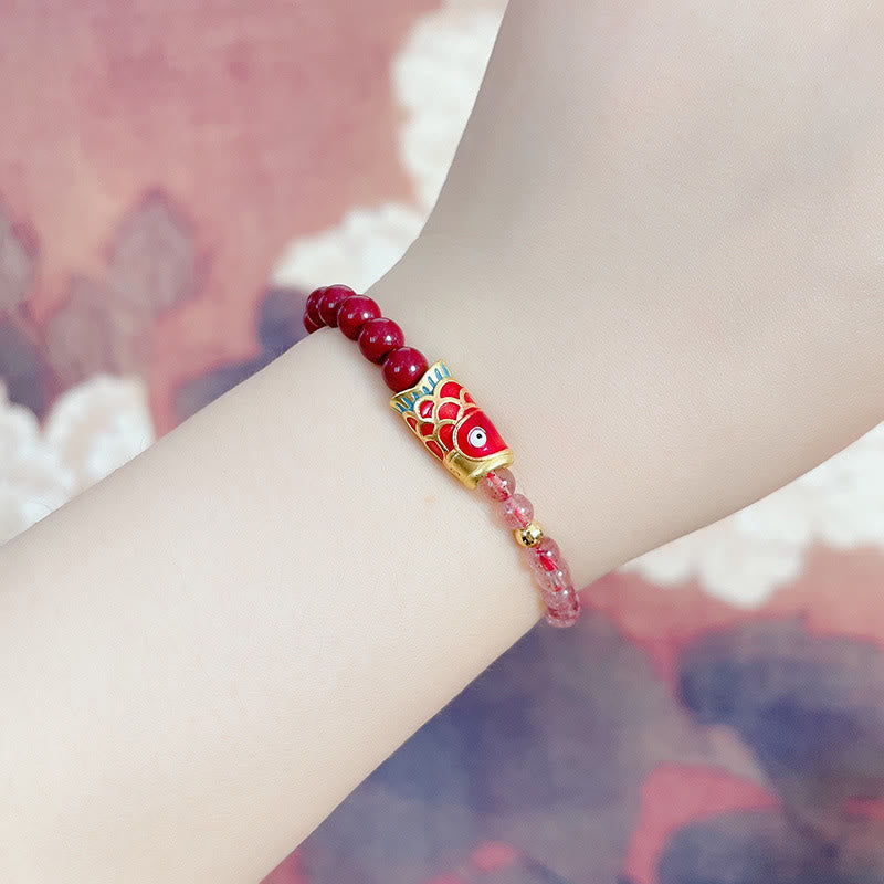 Strawberry Quartz Koi Bracelet – worn on wrist with rolled-up sleeve casual lifestyle look