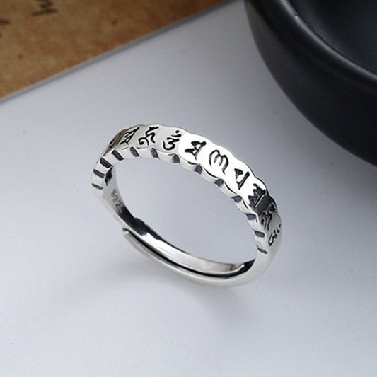 925 Sterling Silver Om Mani Padme Hum Ring – sterling silver mantra ring with S925 stamp, angled top view, Buddhist jewelry