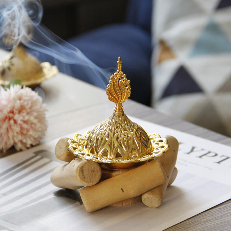 Gold Alloy Mini Incense Burner – arabesque dome on stacked wood log base with smoke trail, brass incense burner decor