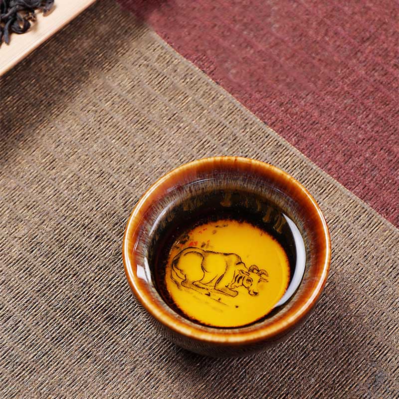 12 Zodiac Jian Zhan Teacup - Rabbit zodiac bunny and radish interior, amber crystalline hare fur glaze exterior