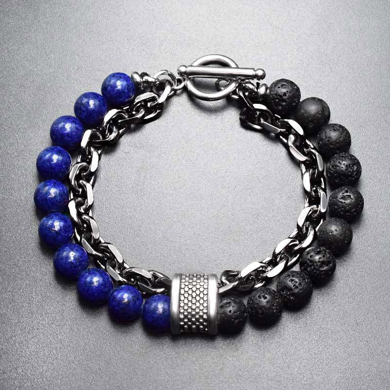 Tiger Eye Lazurite Malachite Protection Bracelet – Overhead view of men's bracelet with deep blue lapis lazuli and black lava stone beads, silver chain, dotted cylinder spacer, and toggle clasp