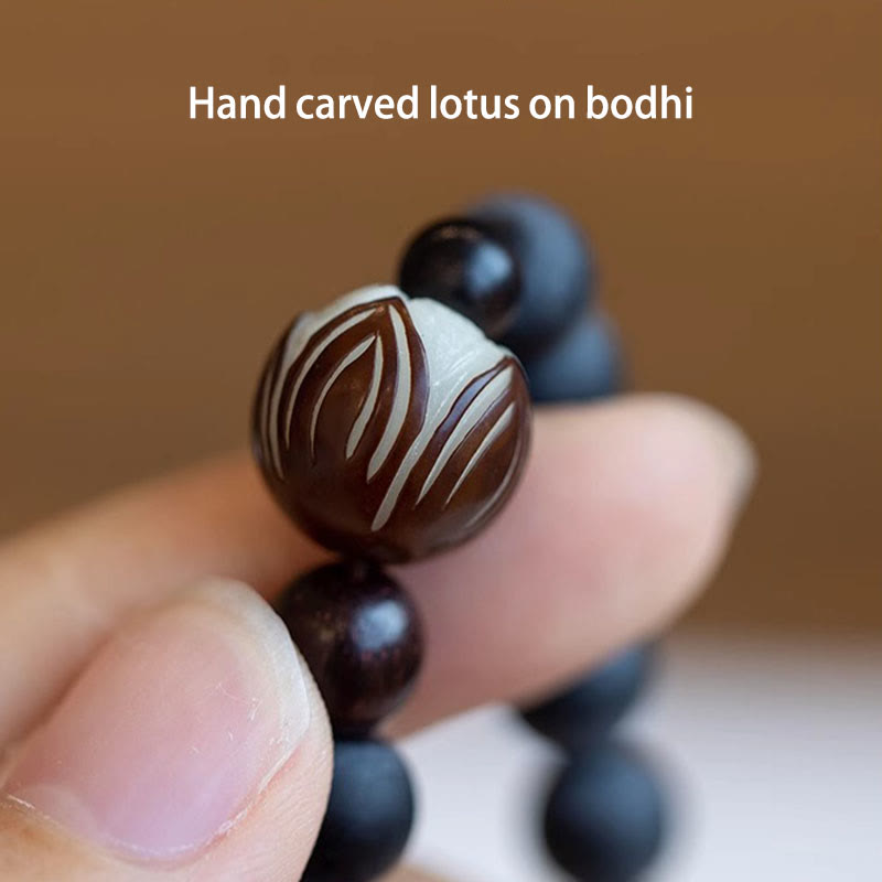Tibetan Cypress Bodhi Lotus Bracelet - hand-carved lotus bodhi seed bead close-up, artisan