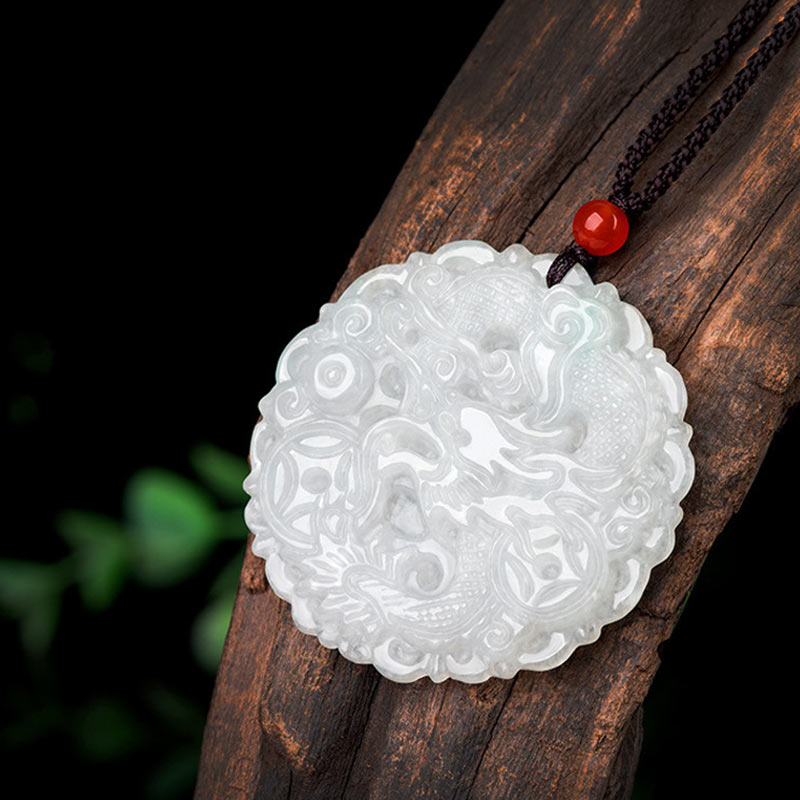 White Jade Dragon Necklace – Scalloped-edge dragon carving on driftwood with green bokeh, Serene