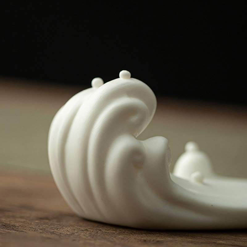 Buddha Monk Sea Wave Mountain Ceramic Incense Burner – Close-up of white ceramic wave sculpture base with mountain details, zen decor