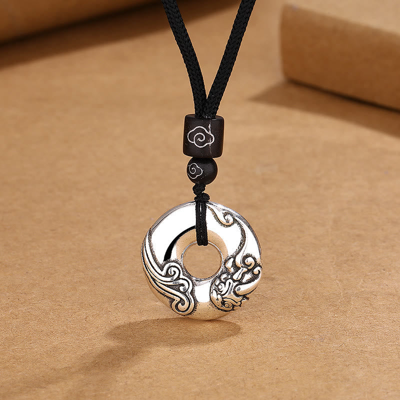 PiXiu Peace Buckle Copper Wealth Necklace – Silver peace buckle with PiXiu carving on black cord, prosperity jewelry
