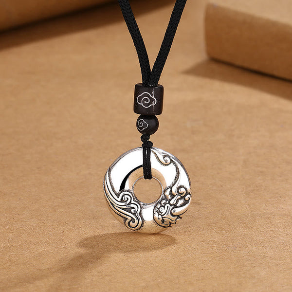 PiXiu Peace Buckle Copper Wealth Necklace – Silver peace buckle with PiXiu carving on black cord, prosperity jewelry