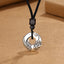 PiXiu Peace Buckle Copper Wealth Necklace – Silver peace buckle with PiXiu carving on black cord, prosperity jewelry