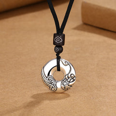PiXiu Peace Buckle Copper Wealth Necklace – Silver peace buckle with PiXiu carving on black cord, prosperity jewelry