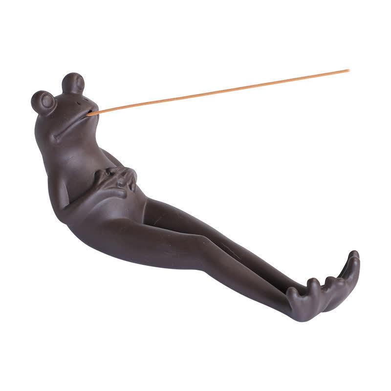 Meditation Frog Ceramic Incense Burner - Dark frog with incense stick on clean background, frog incense burner