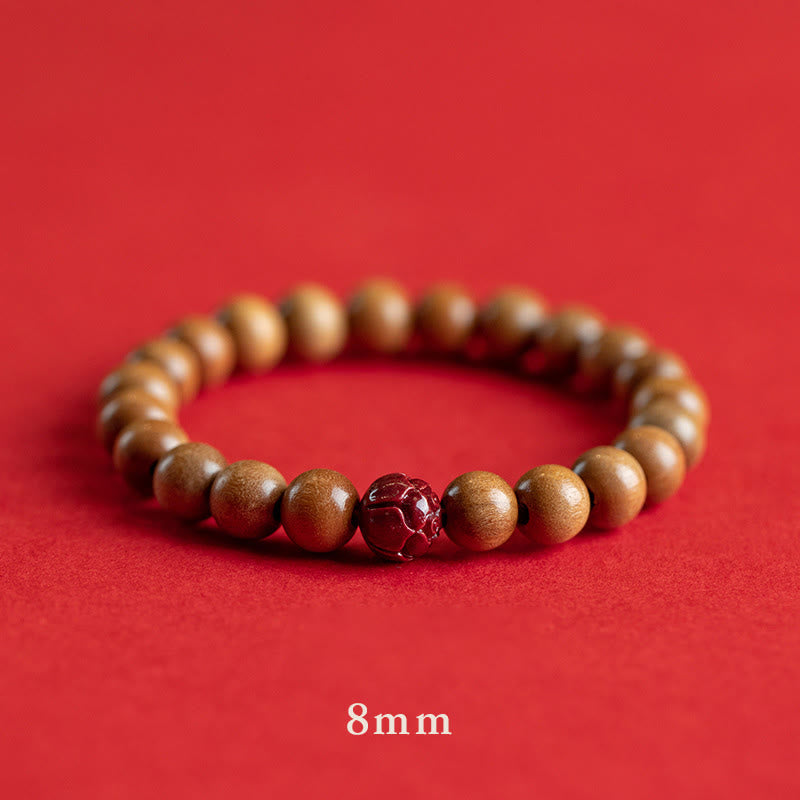 Peach Wood & Cinnabar Lotus Bracelet single strand 8mm, carved burgundy lotus accent bead, natural wood stretch bracelet
