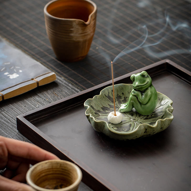 Ceramic Frog Incense Burner – Macro of hand holding incense, Ritual interaction