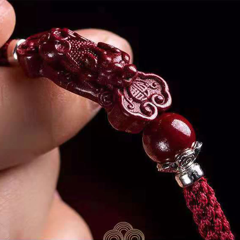 Handcrafted PiXiu Cinnabar Wealth Luck Braided Bracelet – lifestyle wrist model with red dress, good fortune gift