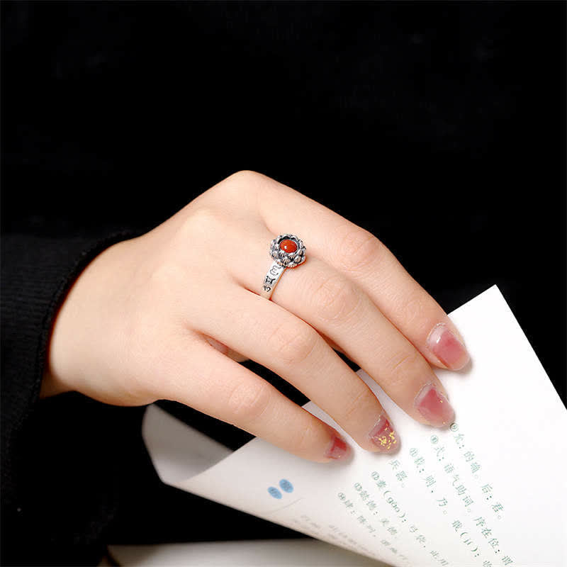925 Silver Lotus Red Agate Ring – vintage oxidized silver lotus ring with carnelian stone worn on hand, dark background lifestyle shot