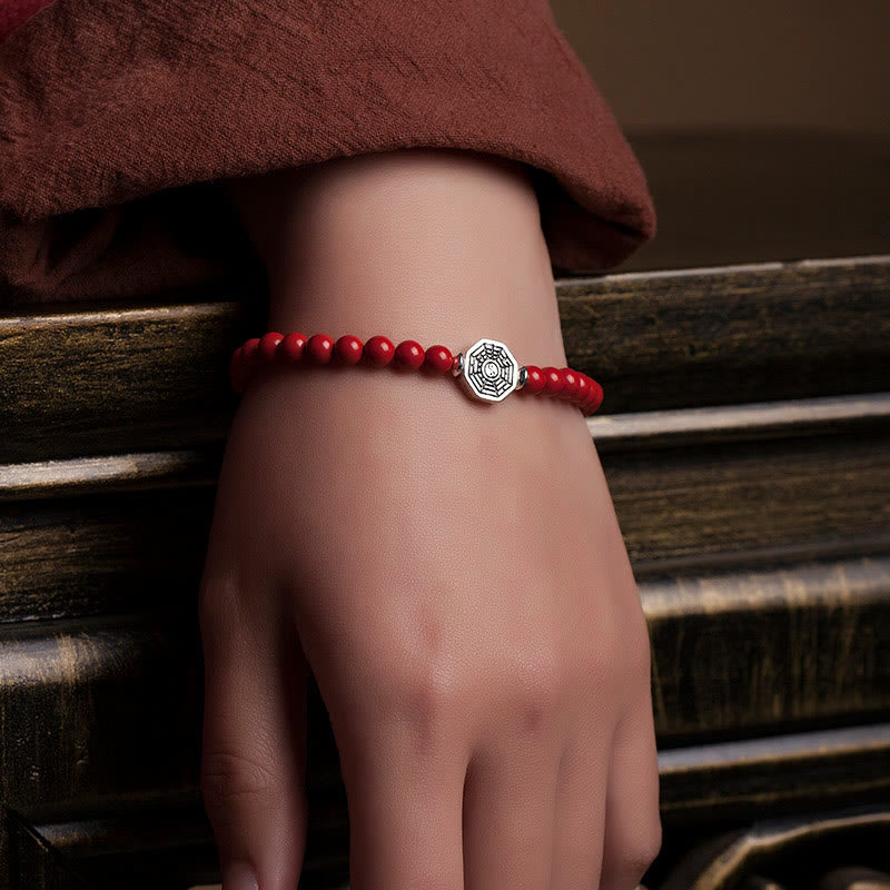 925 Sterling Silver Yin Yang Bagua Cinnabar Bracelet – Red beaded bracelet on mannequin hand, carved wood display