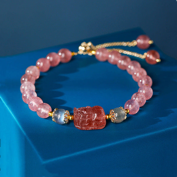 Strawberry Quartz PiXiu Bracelet – pink beads gray accents blue display, love stone