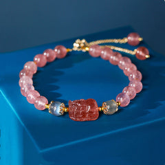 Strawberry Quartz PiXiu Bracelet – pink beads gray accents blue display, love stone