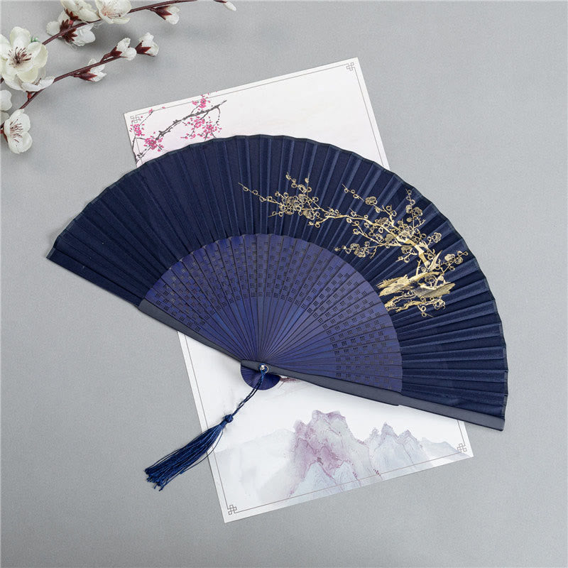 Plum Blossom Fan White – Navy fan with gold plum blossoms on white background, bamboo folding fan