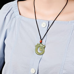 White Jade Cyan Jade Dragon Pendant – green jade dragon necklace worn on model, elegant