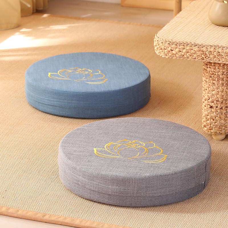 Lotus Meditation Cushion - Blue and gray zafu with gold embroidery on woven mat, floor seating