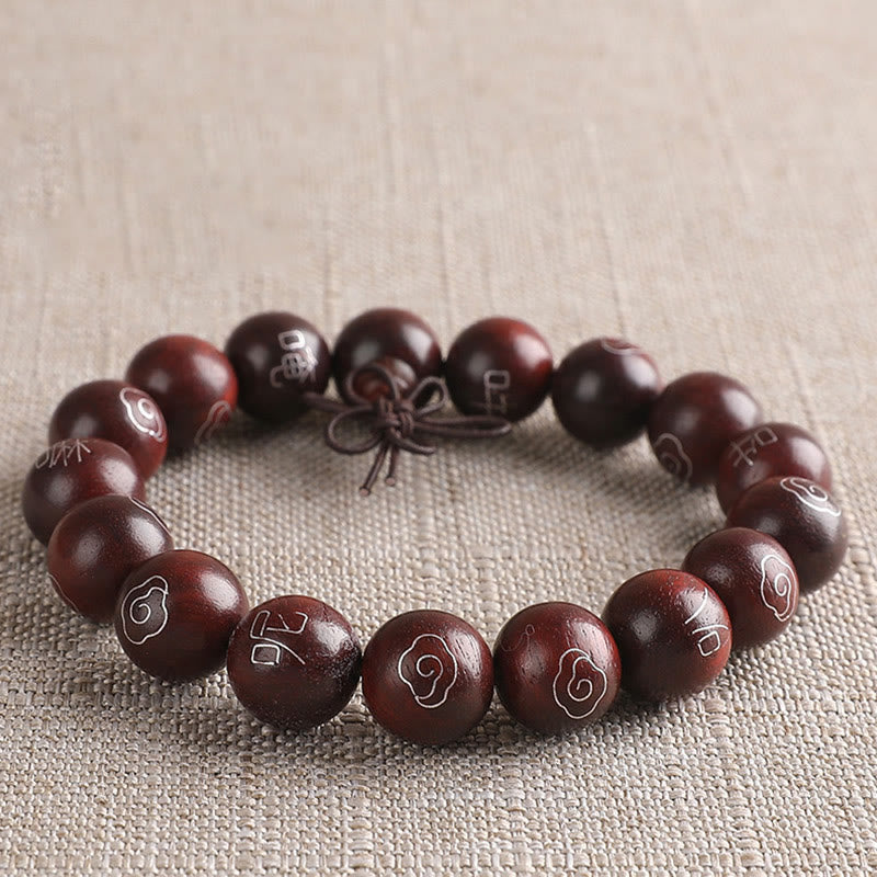 Sterling Silver Sandalwood Mantra Bracelet – angled view of mantra bead details with silver inlay, zen jewelry
