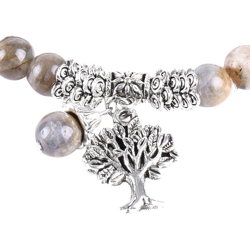 Tree of Life labradorite bracelet with gray-brown schiller beads, silver-toned floral rose motif spacers, detailed Tree of Life pendant.